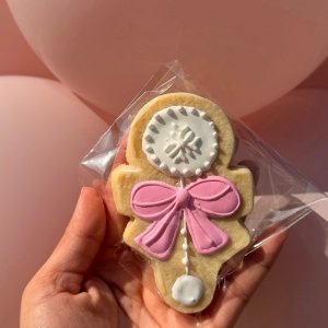 Nutcracker Christmas cookie with pink bow - elegant holiday cookie design