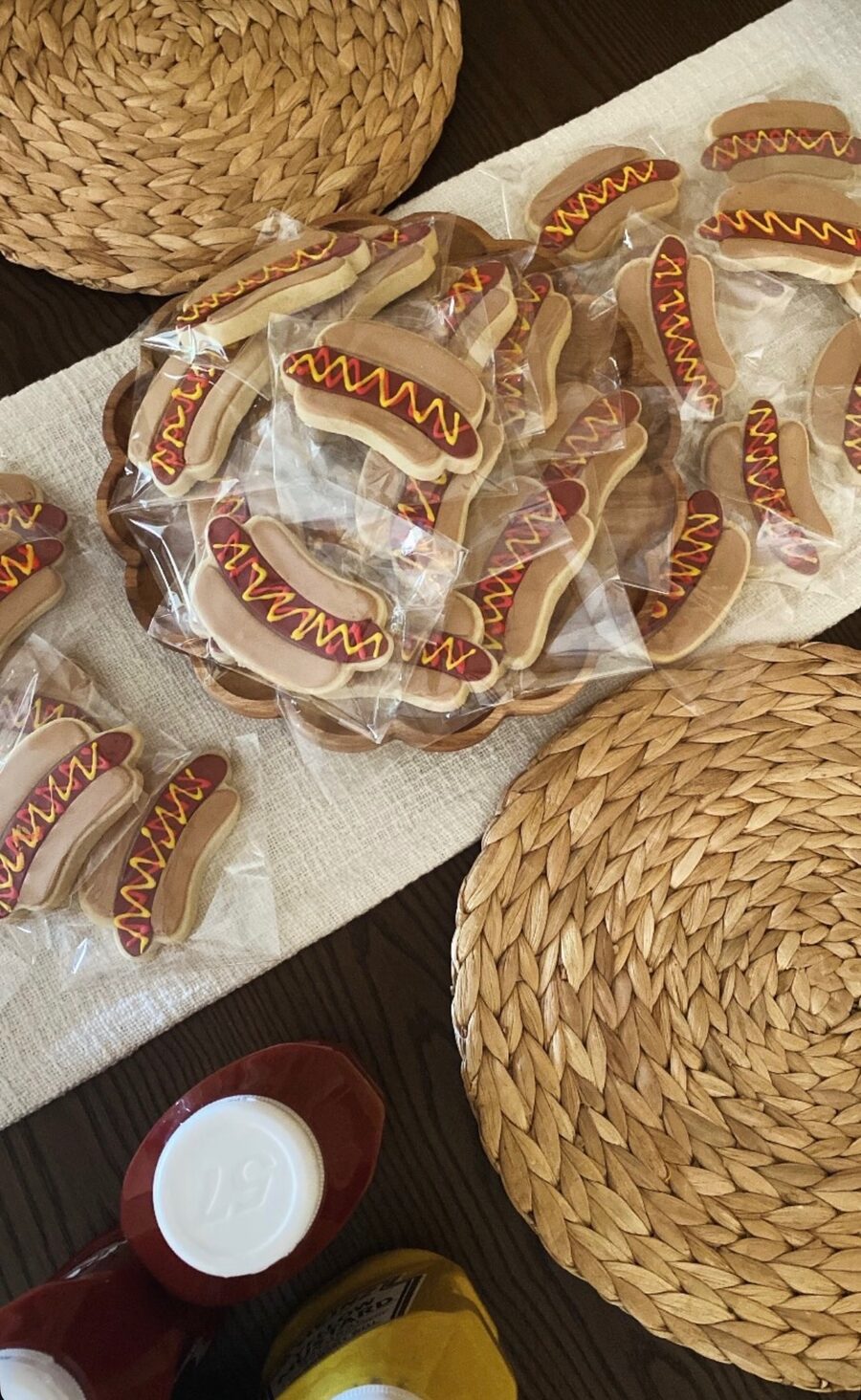 Fun party hotdog cookie set displayed on linen runner